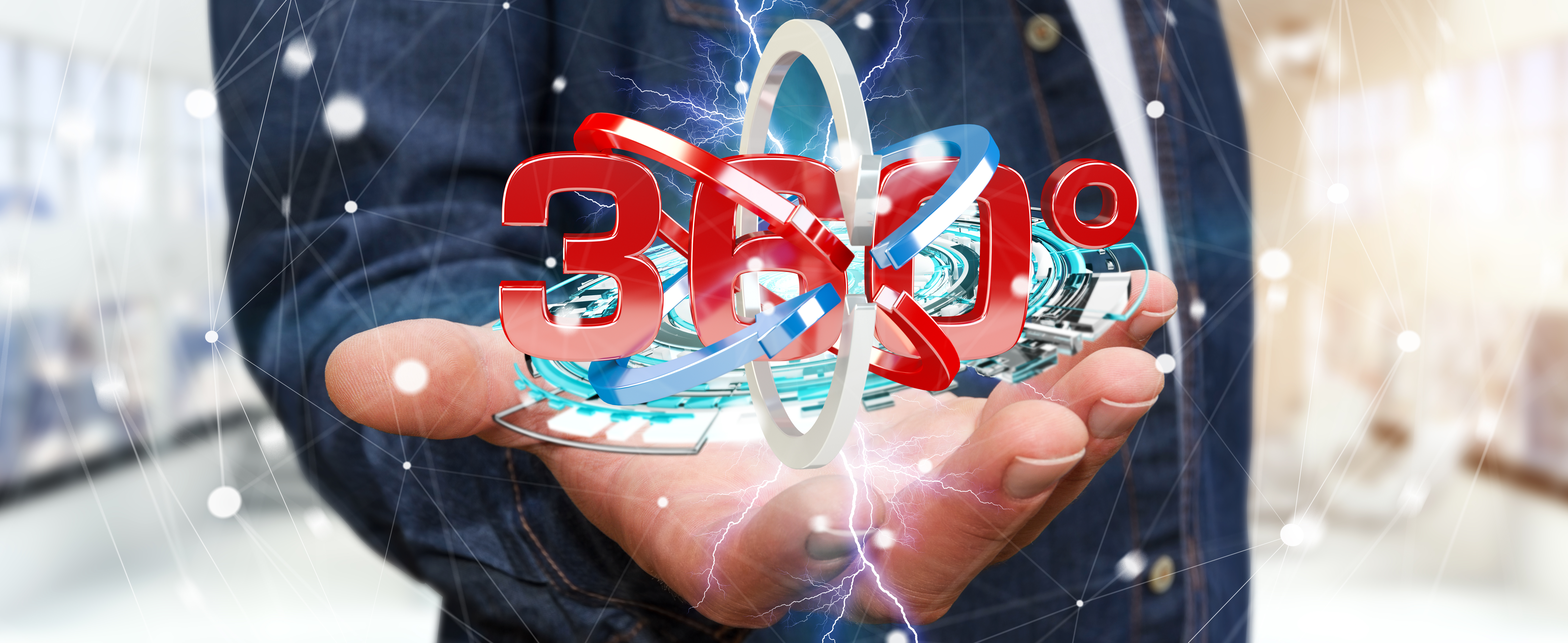 Man on blurred background holding 360 degree 3D render icon in his hand